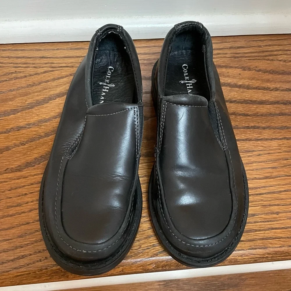 Boys Cole Haan black slip on Air Ace 12